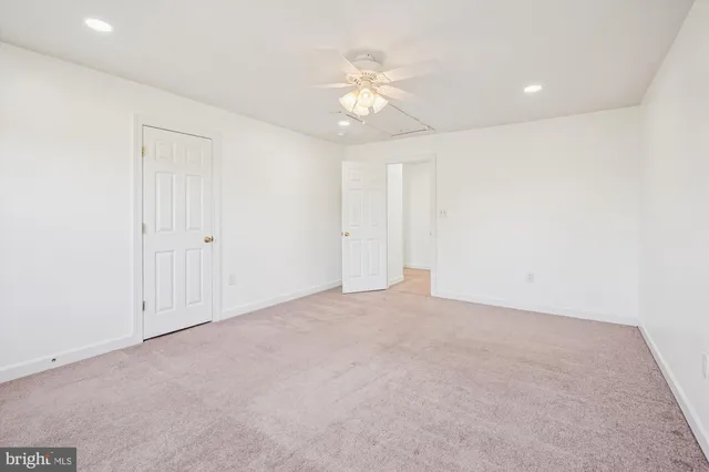 a view of a swimming pool with a yard