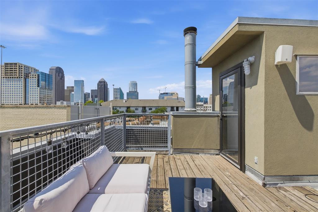 2111 Clark Street, Unit H Dallas, TX 75204 - Photo 34 of 37 a view of roof deck with two chairs and a barbeque