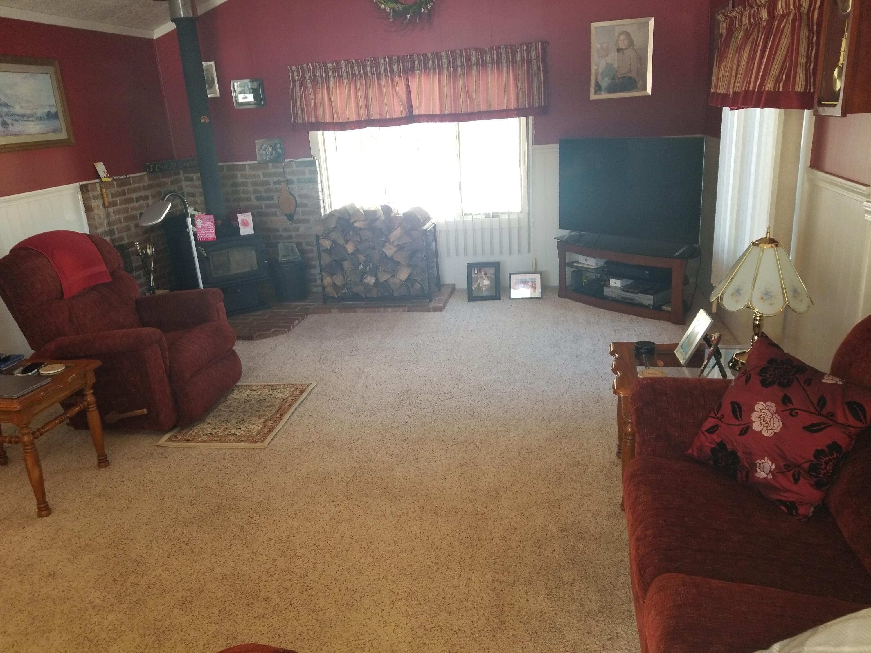 276 Mount Vernon Road Augusta, ME 04330 - Photo 8 of 13 Living room with wood stove