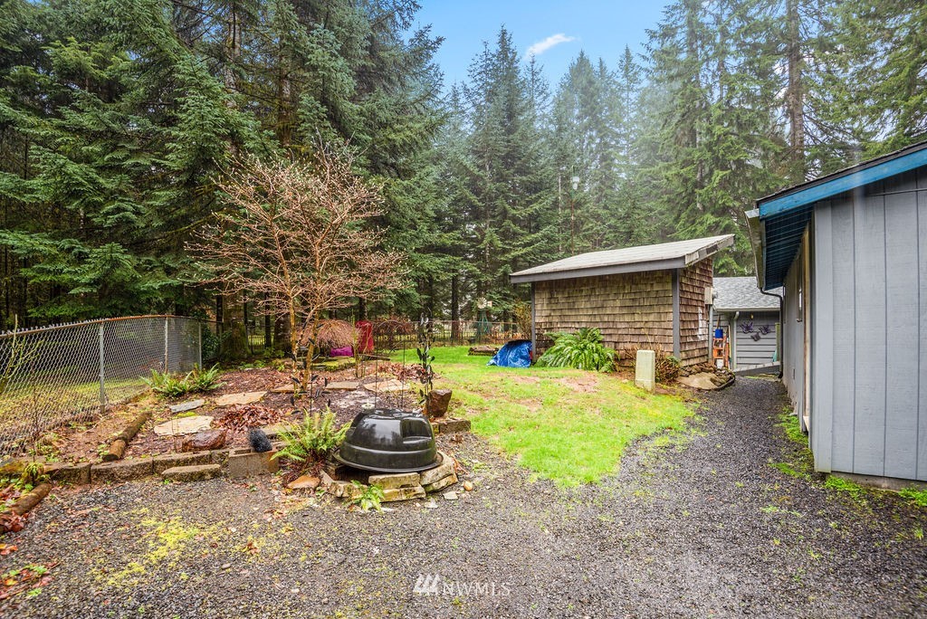 664 Mill Creek Road Longview, WA 98632 - Photo 20 of 22 a view of a house with backyard and sitting area