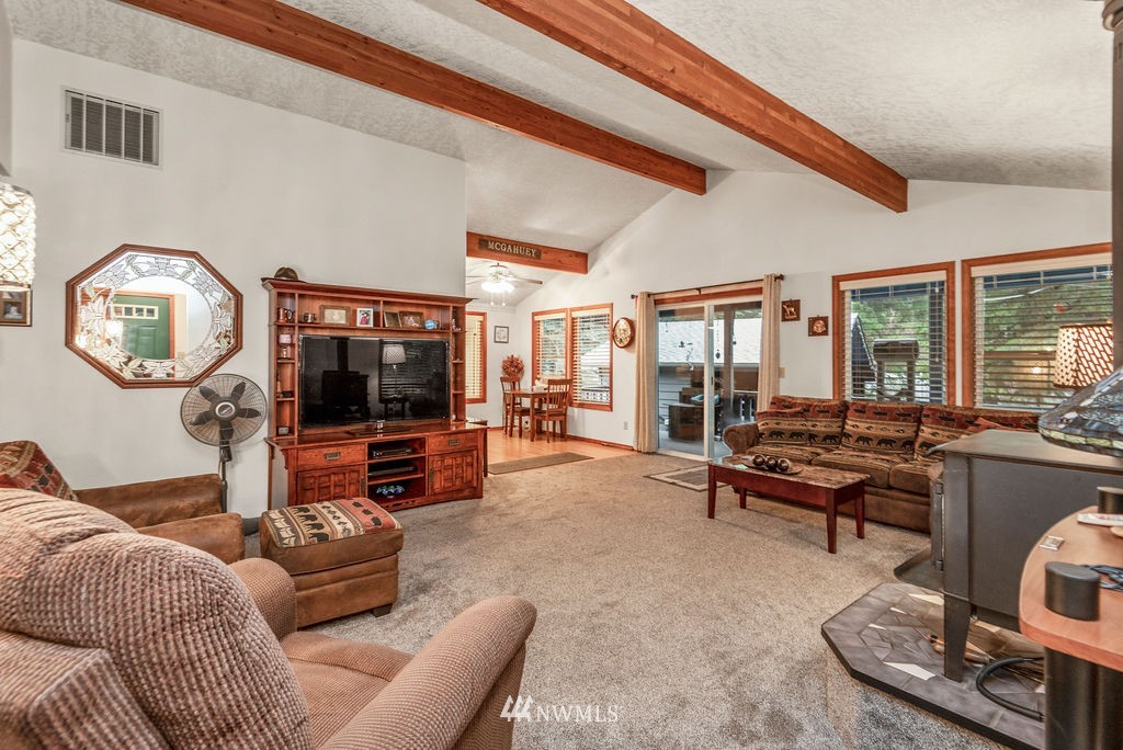 664 Mill Creek Road Longview, WA 98632 - Photo 5 of 22 a living room with furniture and a flat screen tv