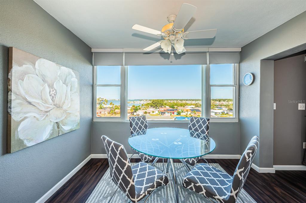 4725 Cove Circle, Unit 604 St. Petersburg, FL 33708 - Photo 26 of 53 a view of a dining room with furniture