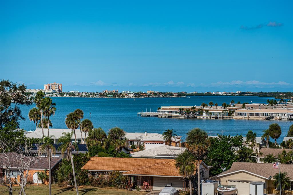 4725 Cove Circle, Unit 604 St. Petersburg, FL 33708 - Photo 27 of 53 a view of a lake with a city view