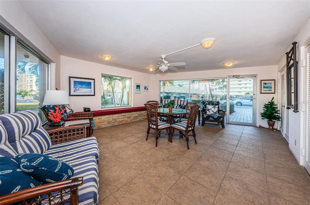 4725 Cove Circle, Unit 604 St. Petersburg, FL 33708 - Photo 36 of 53 a living room with furniture and a large window