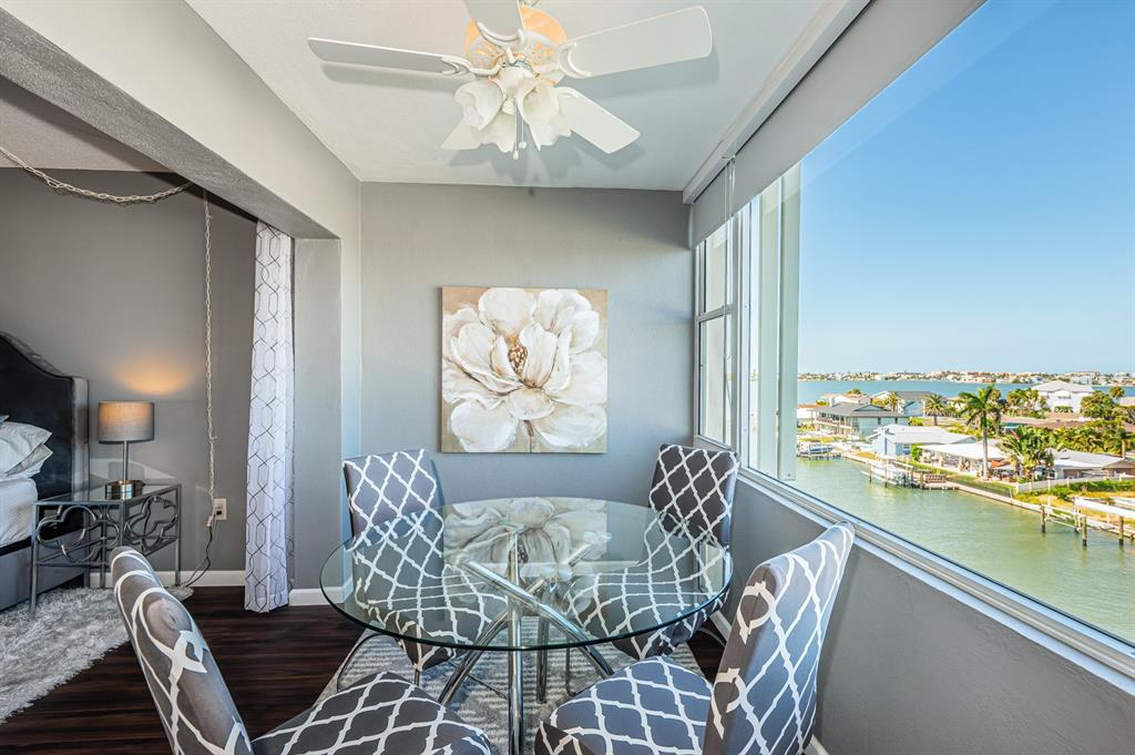 4725 Cove Circle, Unit 604 St. Petersburg, FL 33708 - Photo 5 of 53 a view of a dining room with furniture window and outside view