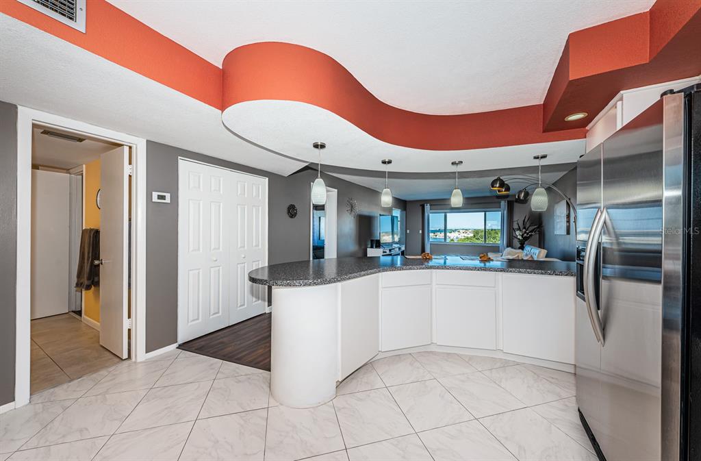4725 Cove Circle, Unit 604 St. Petersburg, FL 33708 - Photo 10 of 53 a kitchen with stainless steel appliances granite countertop a refrigerator and a sink