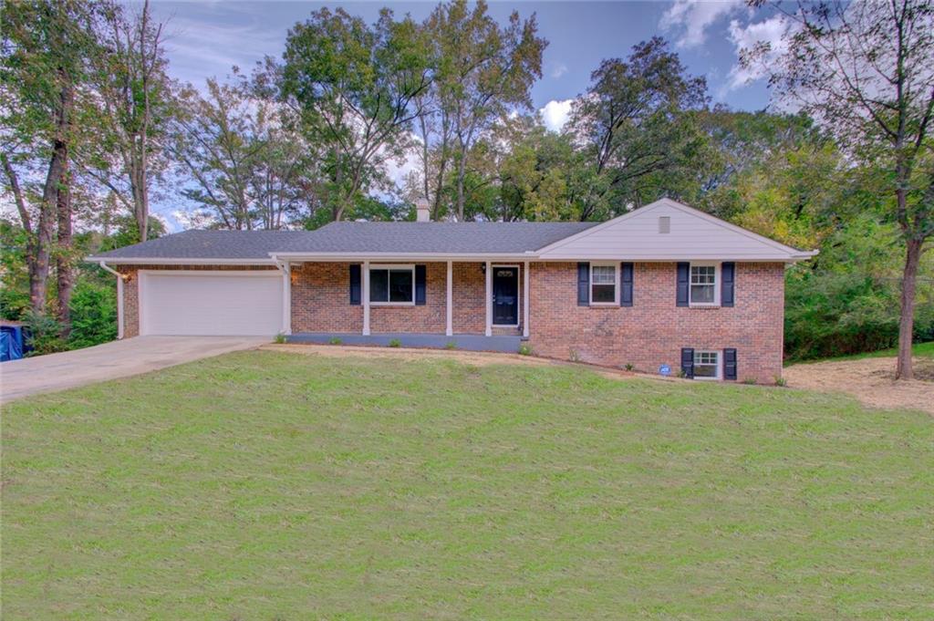 2569 Treadway Drive Decatur, GA 30034 - Photo 1 of 1 a front view of a house with yard and green space