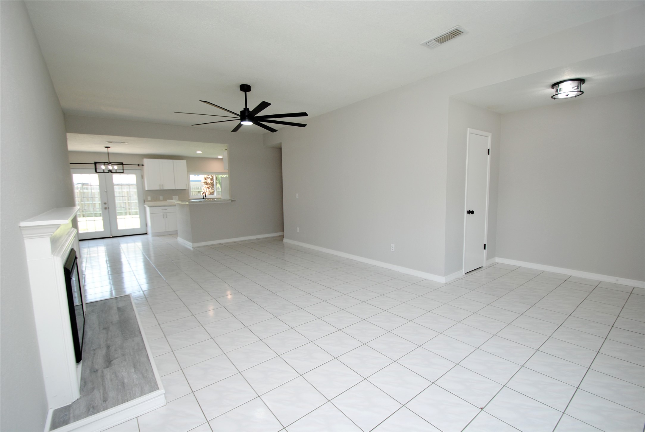 22831 John Rolfe Lane Katy, TX 77449 - Photo 6 of 34 wooden floor in an empty room with a window