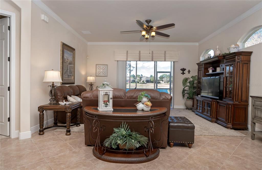 202 Lourdan Court DeBary, FL 32713 - Photo 11 of 38 a living room with furniture and a flat screen tv