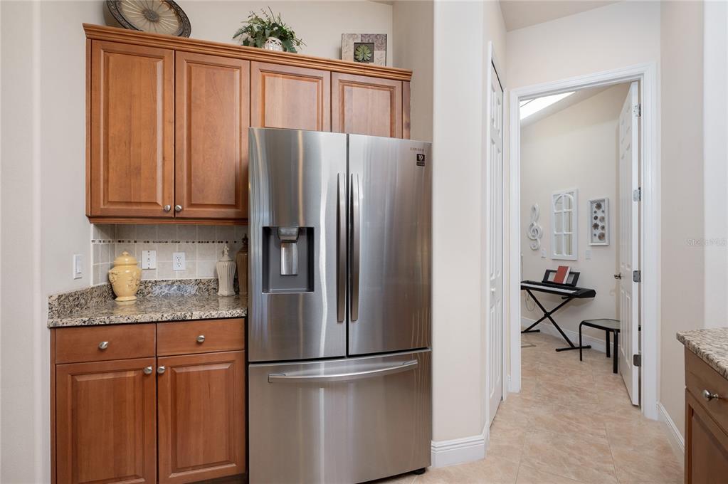 202 Lourdan Court DeBary, FL 32713 - Photo 16 of 38 a kitchen with stainless steel appliances granite countertop a refrigerator and a stove