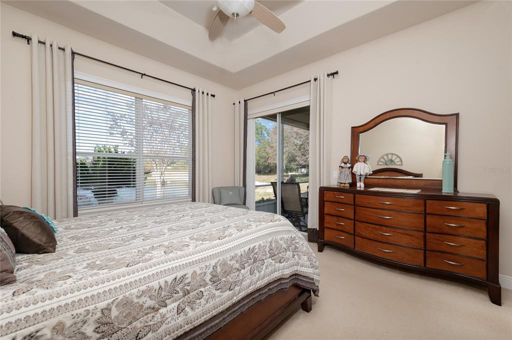 202 Lourdan Court DeBary, FL 32713 - Photo 21 of 38 a bedroom with a bed and a dresser