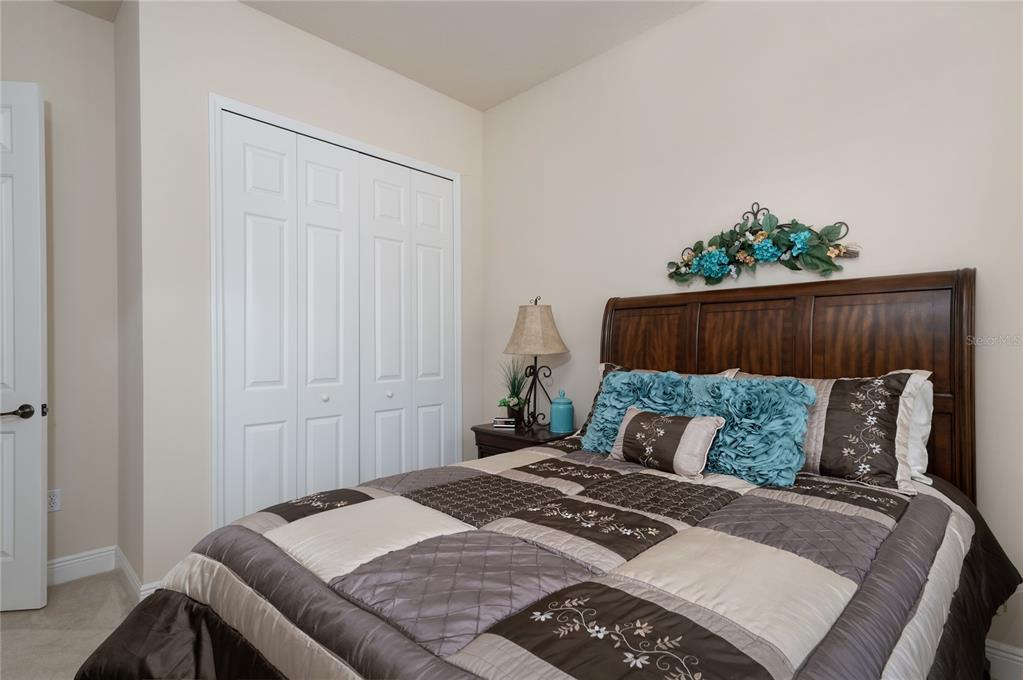 202 Lourdan Court DeBary, FL 32713 - Photo 26 of 38 a bedroom with a bed and a window