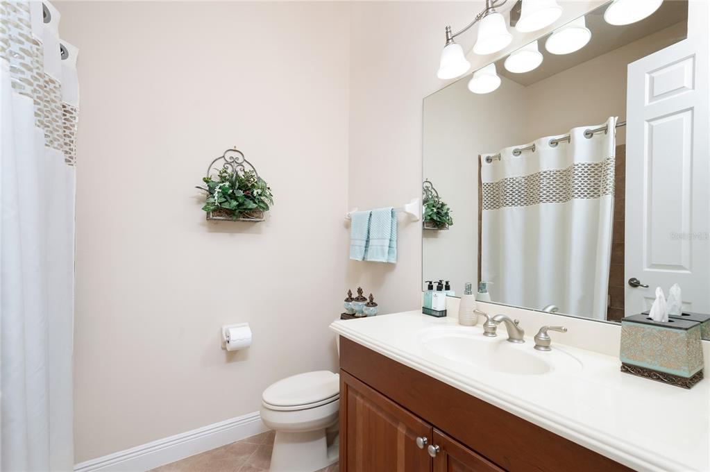 202 Lourdan Court DeBary, FL 32713 - Photo 27 of 38 a bathroom with a sink vanity granite and toilet