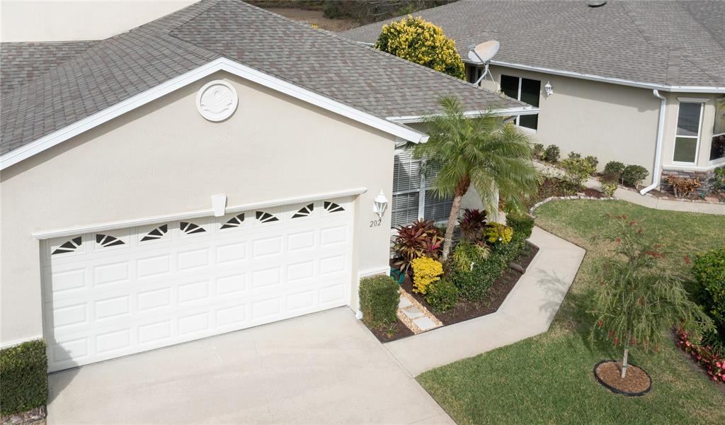 202 Lourdan Court DeBary, FL 32713 - Photo 4 of 38 an aerial view of a house with garden