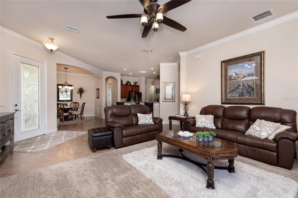 202 Lourdan Court DeBary, FL 32713 - Photo 10 of 38 a living room with furniture and a wooden floor