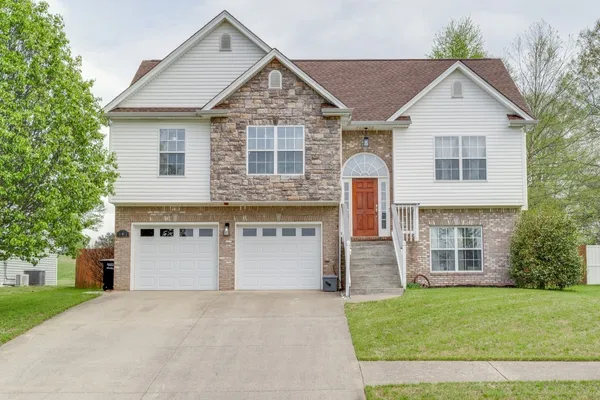 front view of a house with a yard