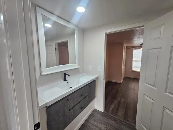 a bathroom with a sink and a mirror