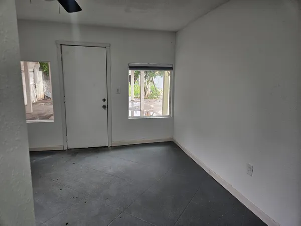 a view of an empty room with a window