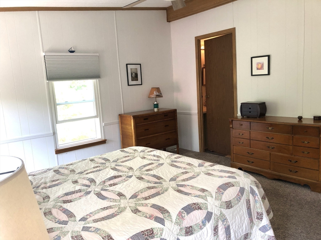 41 Pipers Way Carver, MA 02330 - Photo 18 of 36 a bedroom with a bed and a dresser