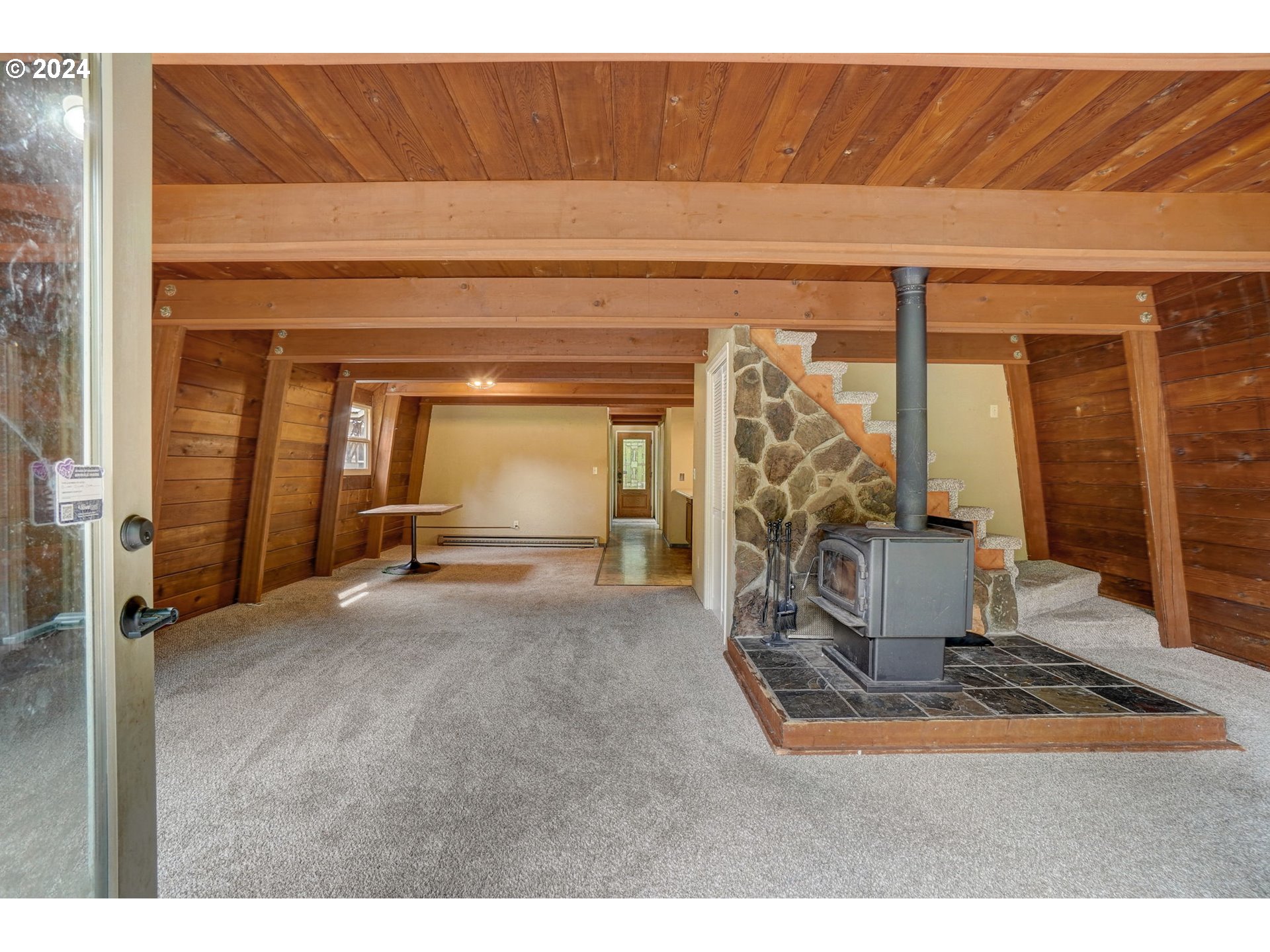 2162 East Loop Road Stevenson, WA 98648 - Photo 11 of 48 a view of a livingroom with wooden floor and a large window