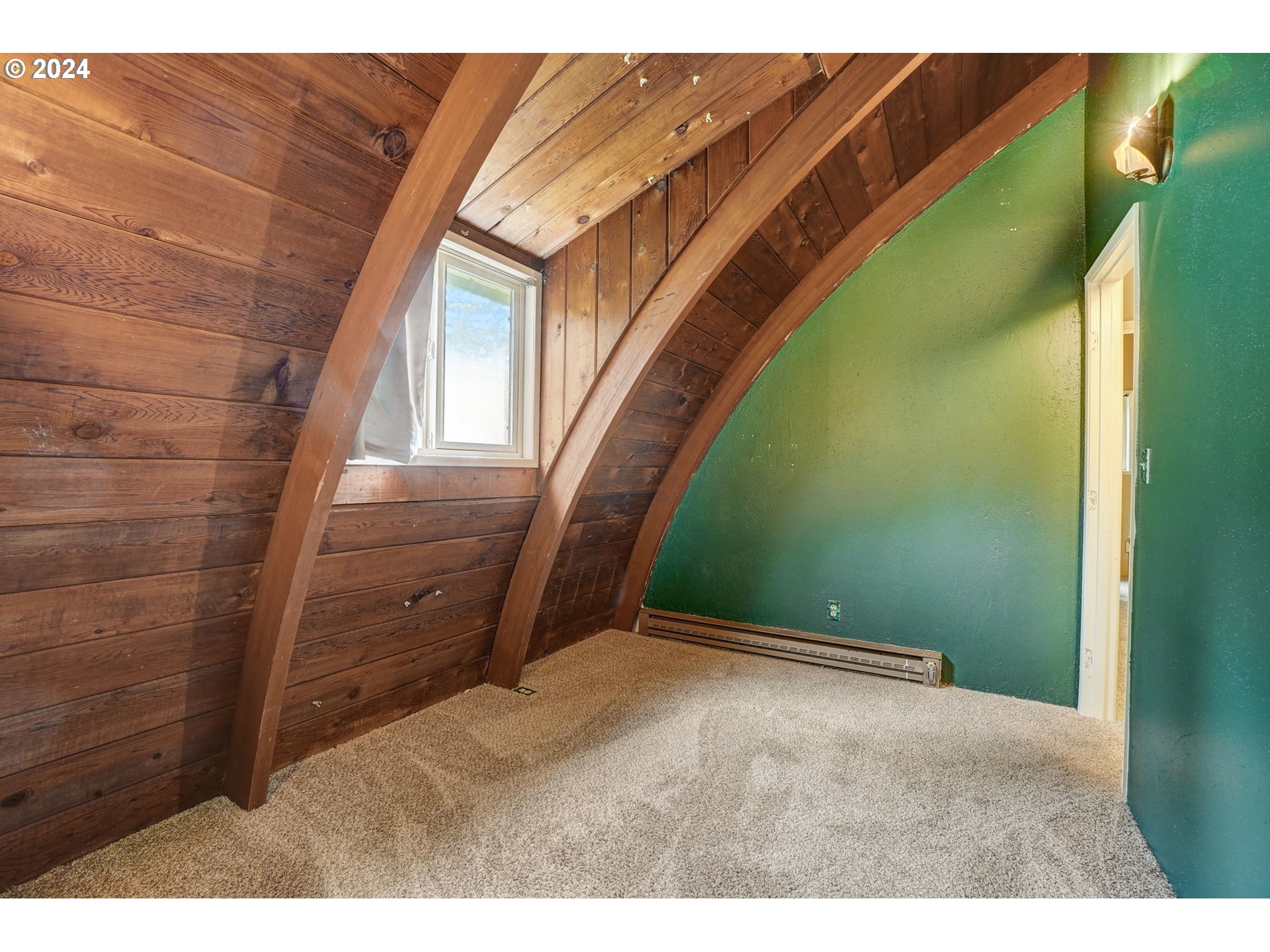 2162 East Loop Road Stevenson, WA 98648 - Photo 29 of 48 a view of an empty room with wooden floor