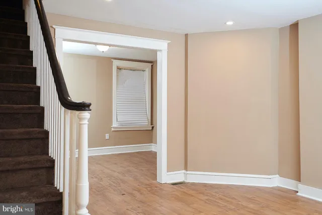 an entryway with wooden floor and entryway
