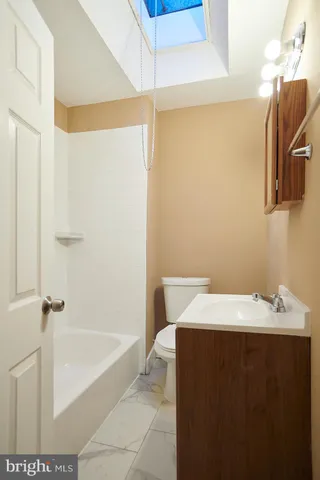 a bathroom with a bathtub and a sink