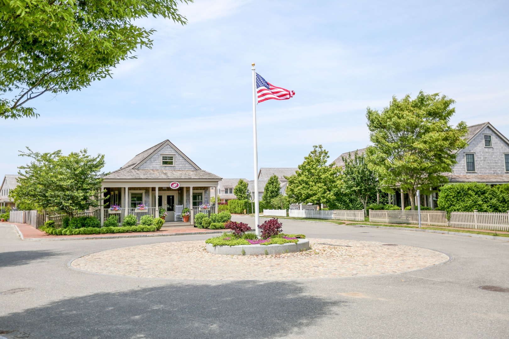 2 Wood Lily Road Nantucket, MA 02554 - Photo 30 of 38 a front view of a house with a garden