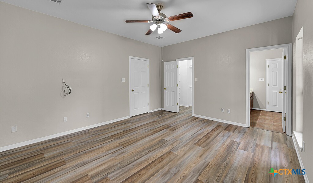 3900 Fox Ridge Road Lorena, TX 76655 - Photo 15 of 35 wooden floor in an empty room with a window