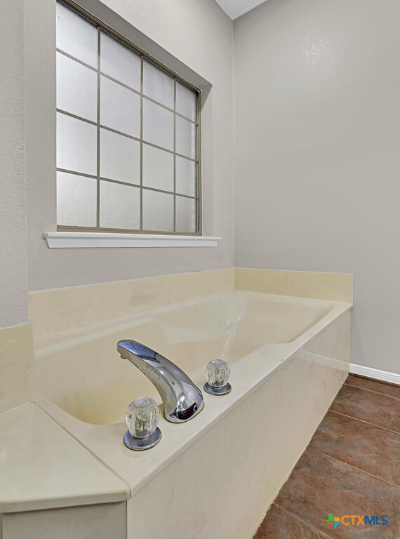 3900 Fox Ridge Road Lorena, TX 76655 - Photo 17 of 35 a bathroom with a tub