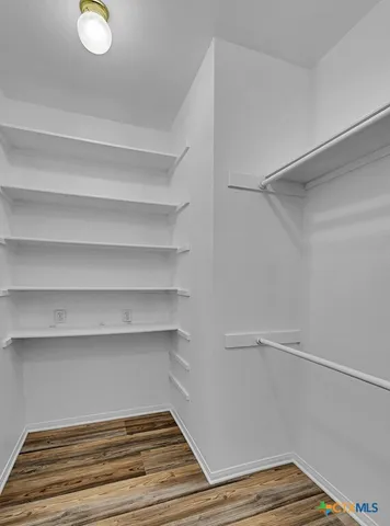 a view of an empty walk in closet
