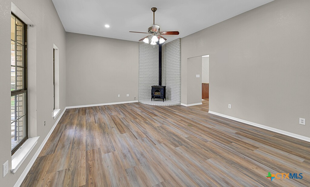 3900 Fox Ridge Road Lorena, TX 76655 - Photo 3 of 35 wooden floor in an empty room with a window