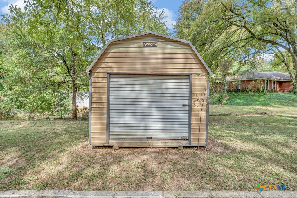 3900 Fox Ridge Road Lorena, TX 76655 - Photo 31 of 35 a view of a house with a yard and large tree