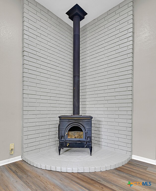 3900 Fox Ridge Road Lorena, TX 76655 - Photo 5 of 35 a view of a livingroom with wooden floor and a potted plant