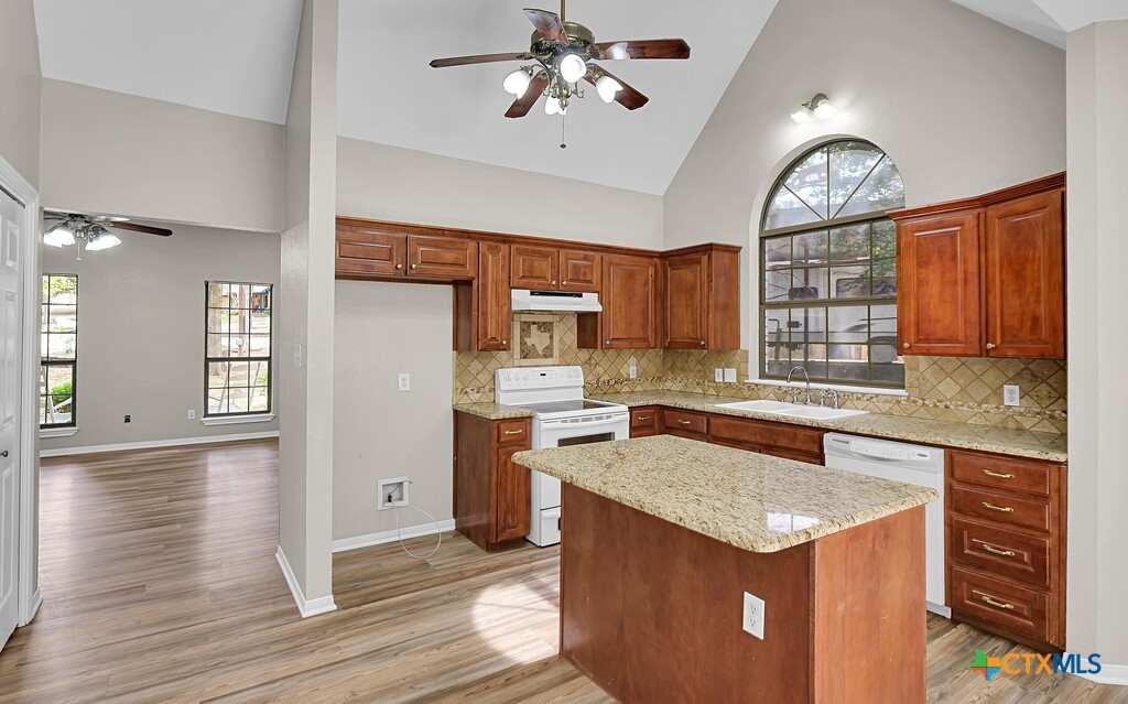 3900 Fox Ridge Road Lorena, TX 76655 - Photo 8 of 35 a kitchen with a stove a sink and a refrigerator