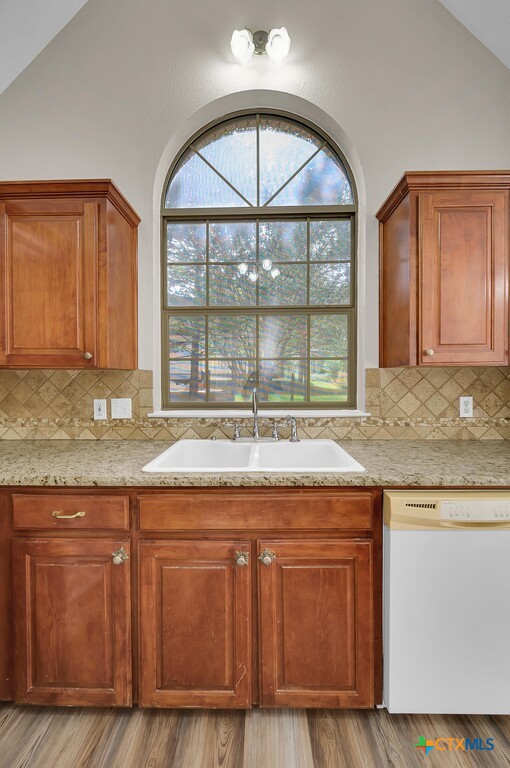 3900 Fox Ridge Road Lorena, TX 76655 - Photo 10 of 35 a kitchen with granite countertop a stove and a sink