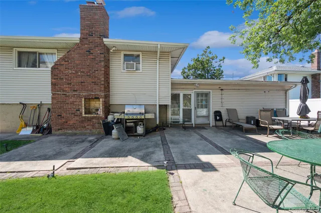 a view of a backyard with furniture