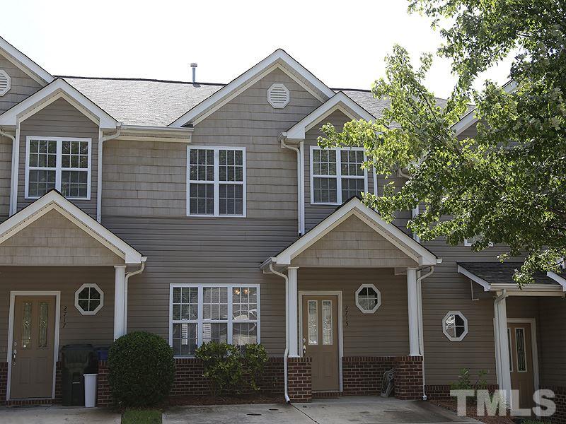 2715 Andover Glen Road Raleigh, NC 27604 - Photo 1 of 16 a front view of a house with a yard