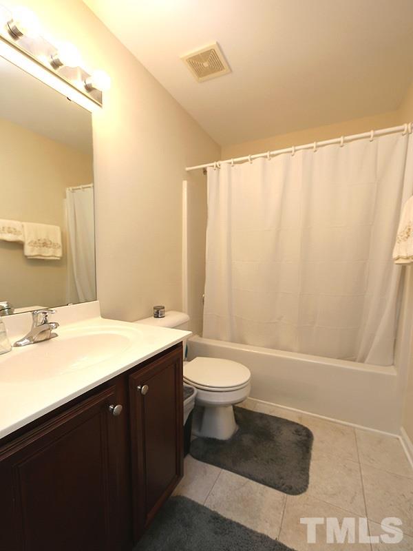 2715 Andover Glen Road Raleigh, NC 27604 - Photo 12 of 16 a bathroom with a sink a toilet and shower