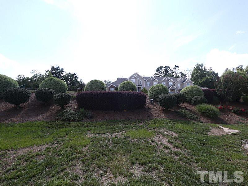 2715 Andover Glen Road Raleigh, NC 27604 - Photo 15 of 16 a view of a garden with a lake