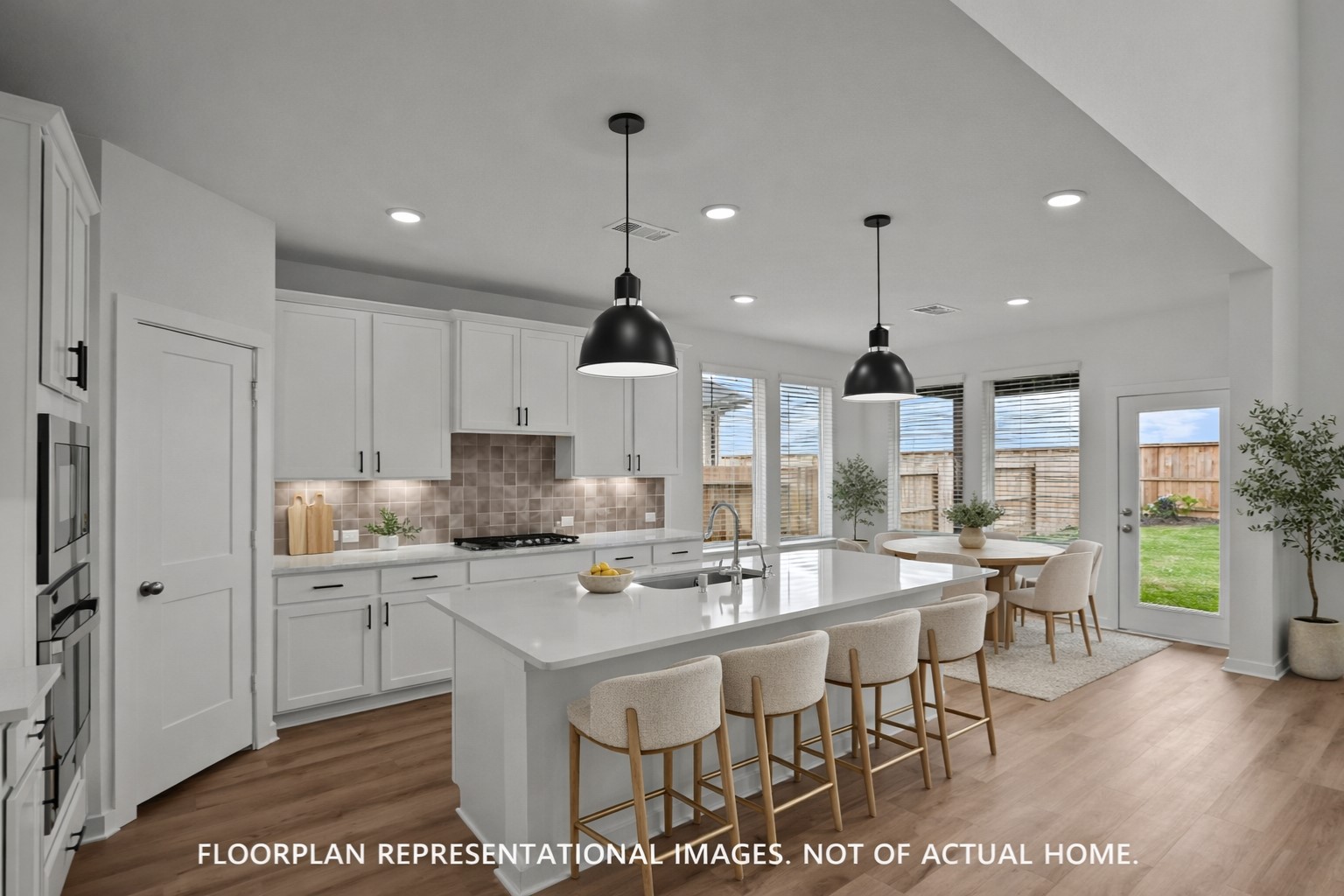 2014 Heather Rdg Way Rosenberg, TX 77471 - Photo 6 of 23 a kitchen with stainless steel appliances kitchen island granite countertop a stove a sink and a refrigerator