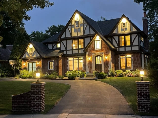 a front view of a residential houses with yard