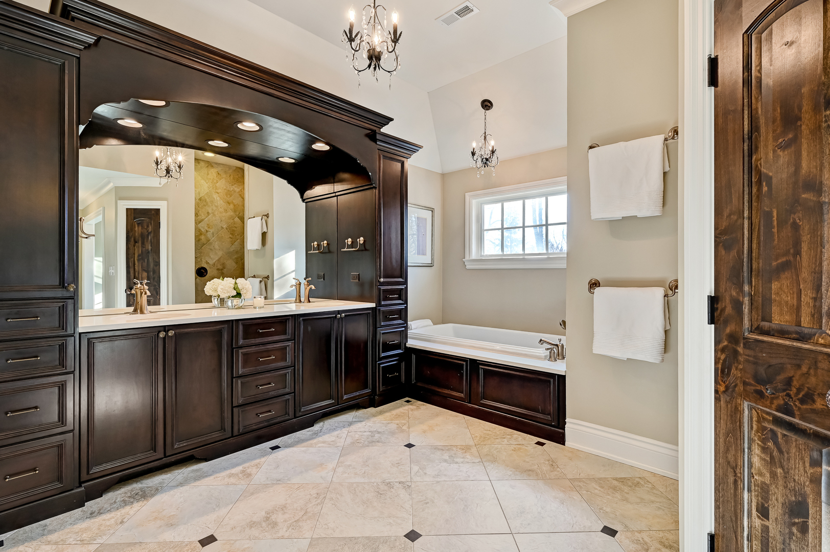 359 Ruby Street Clarendon Hills, IL 60514 - Photo 24 of 45 a bathroom with a sink a large mirror and a shower