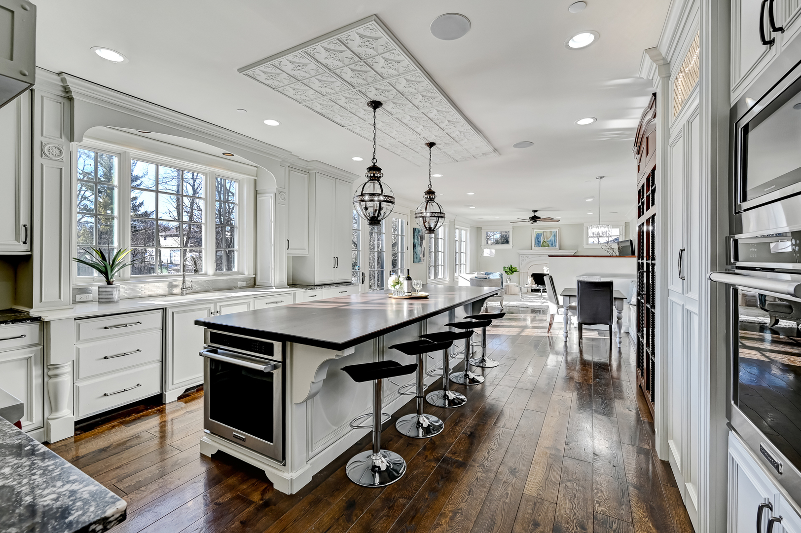 359 Ruby Street Clarendon Hills, IL 60514 - Photo 9 of 45 a kitchen with stainless steel appliances granite countertop a stove and cabinets with wooden floor