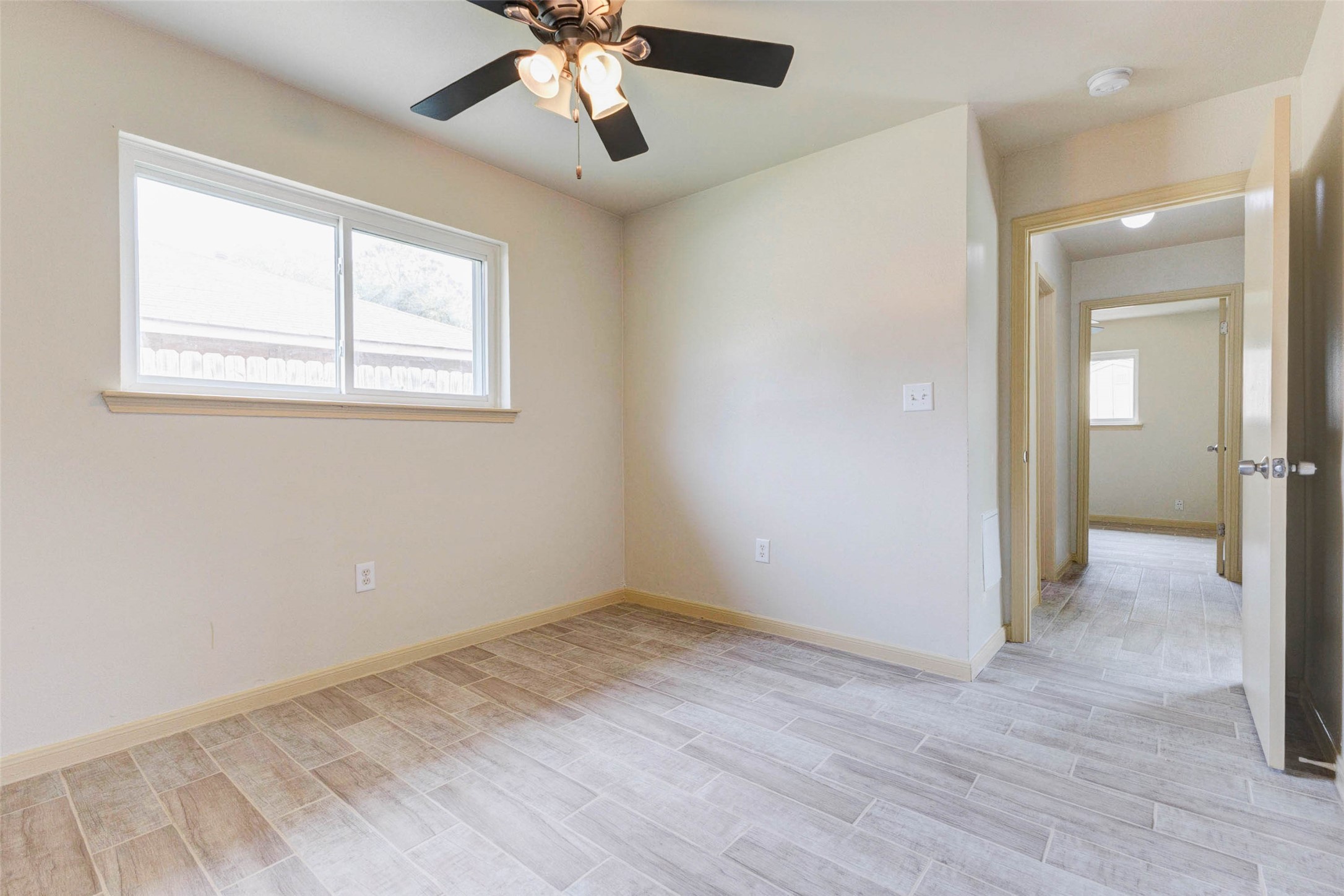 5319 Ridgestone Street Houston, TX 77053 - Photo 21 of 26 an empty room with a empty space and a ceiling fan