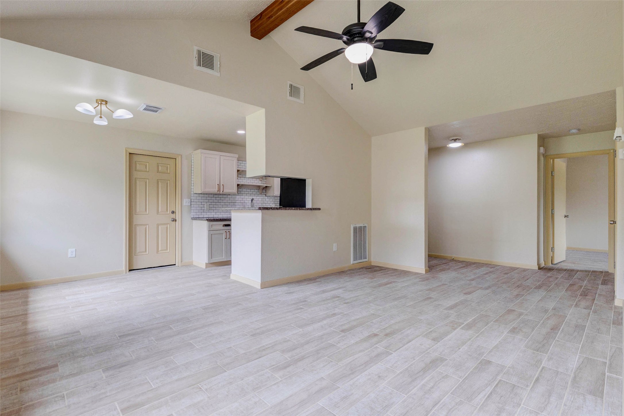 5319 Ridgestone Street Houston, TX 77053 - Photo 6 of 26 a view of a kitchen with a microwave and a ceiling fan