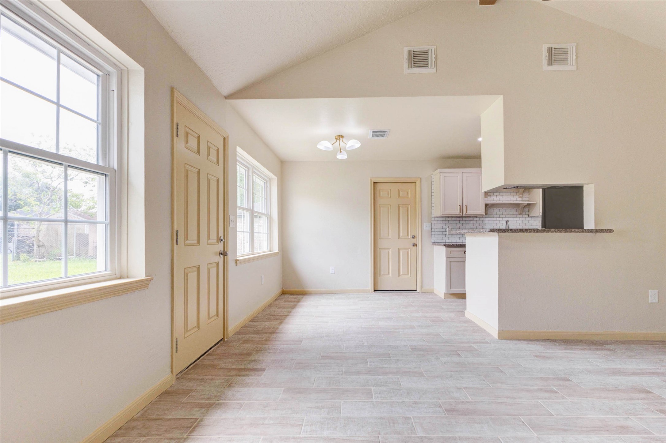 5319 Ridgestone Street Houston, TX 77053 - Photo 7 of 26 a view of a kitchen with a sink and dishwasher a refrigerator with white cabinets
