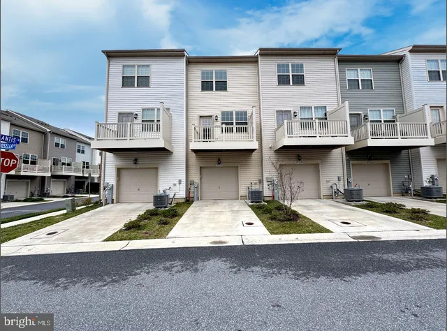 a front view of a building with lot of windows