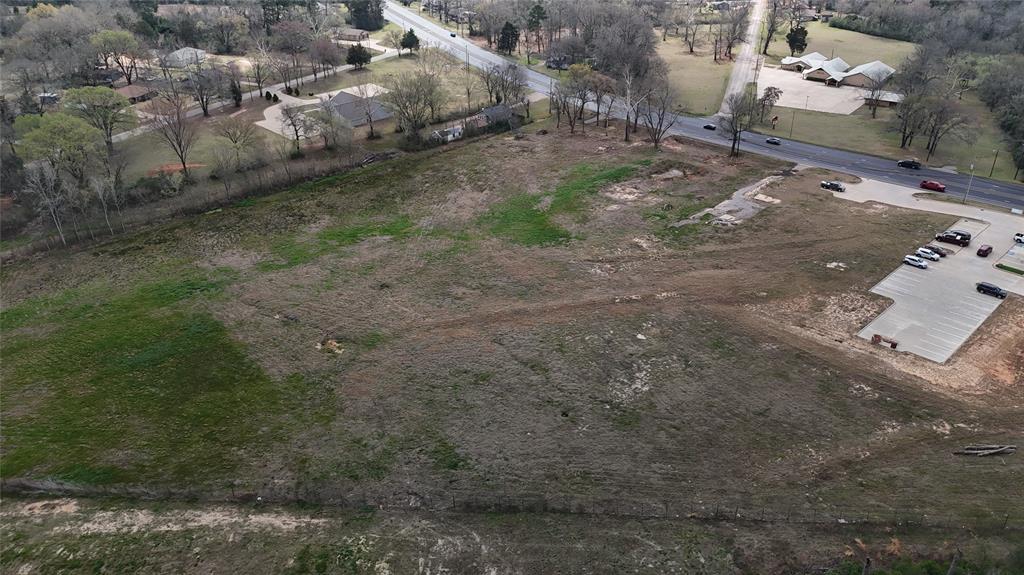 2228 Crockett Road Palestine, TX 75801 - Photo 3 of 7 a view of a dry yard with trees