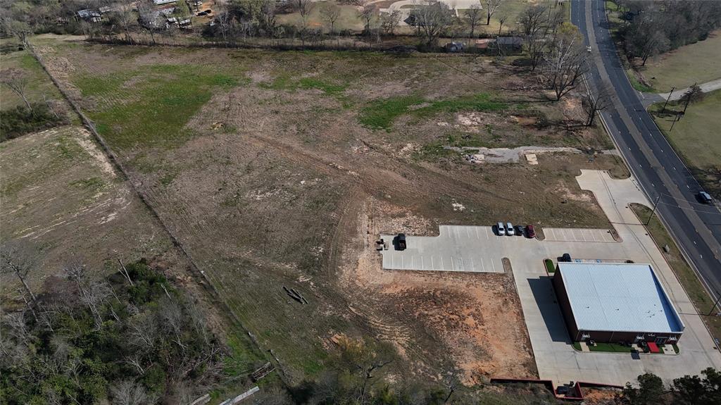 2228 Crockett Road Palestine, TX 75801 - Photo 6 of 7 an aerial view of a house with a yard and lake view